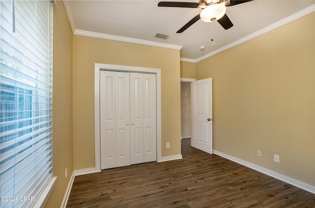 unfurnished room with ornamental molding, dark hardwood / wood-style flooring, and ceiling fan