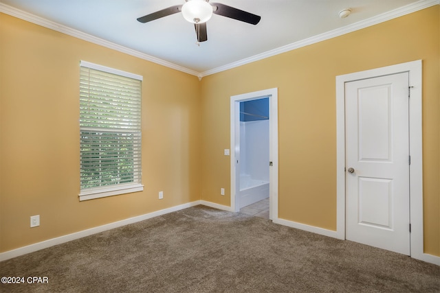 empty room with ceiling fan, light colored carpet, and crown molding