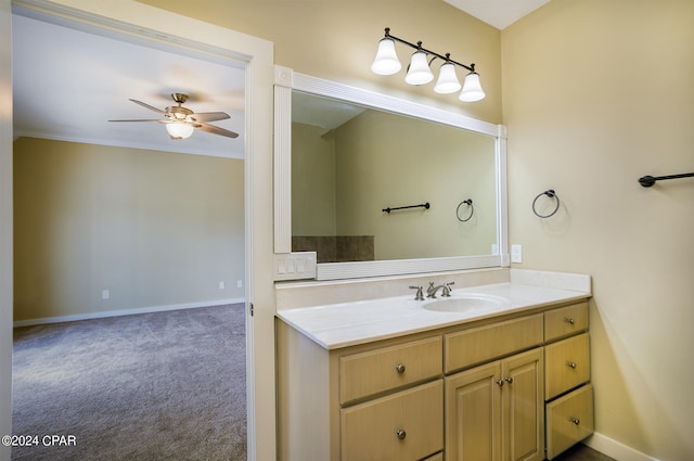 carpeted empty room with crown molding and ceiling fan