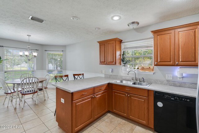 kitchen with dishwasher, kitchen peninsula, a healthy amount of sunlight, and sink