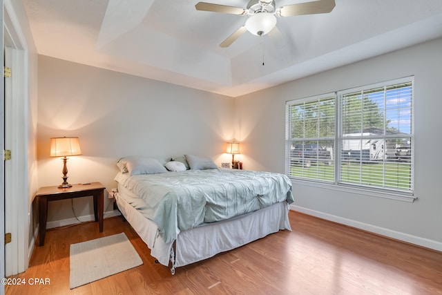 bedroom featuring ceiling fan and hardwood / wood-style floors