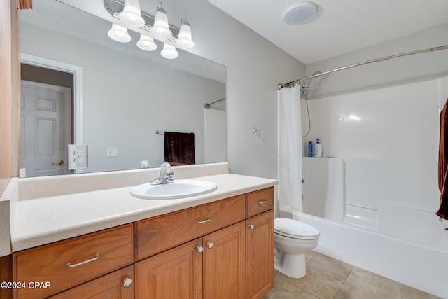 full bathroom with vanity, tile patterned flooring, toilet, and shower / tub combo with curtain