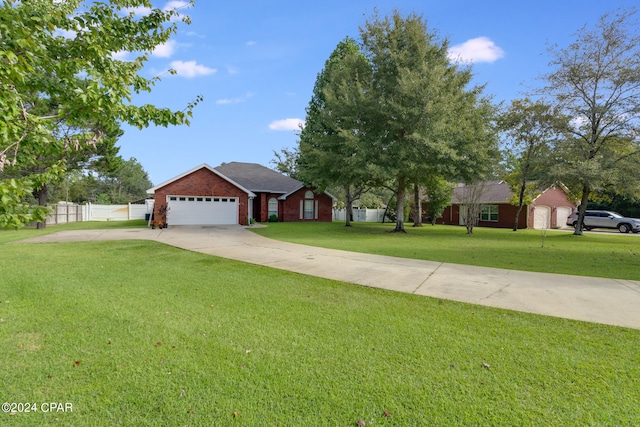 ranch-style home with a garage and a front yard