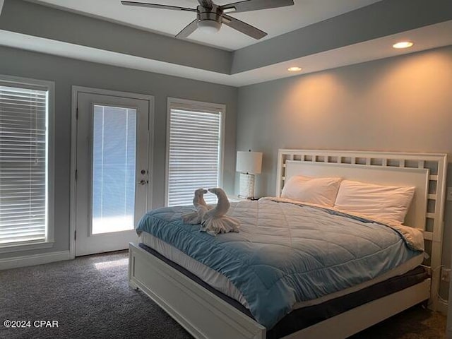 carpeted bedroom with ceiling fan and access to exterior