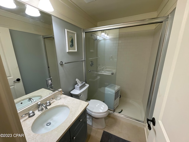 bathroom featuring vanity, tile patterned floors, a shower with shower door, and toilet