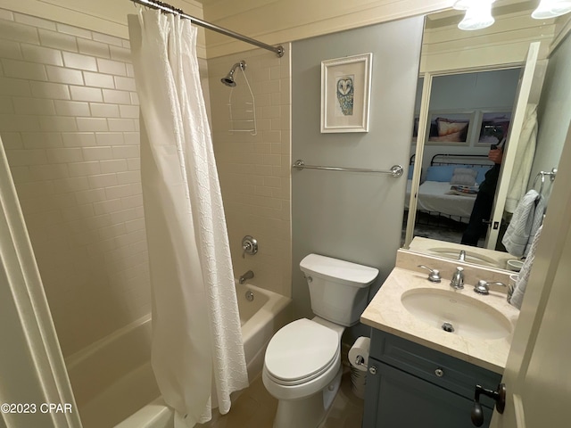 full bathroom with shower / bath combo with shower curtain, vanity, and toilet