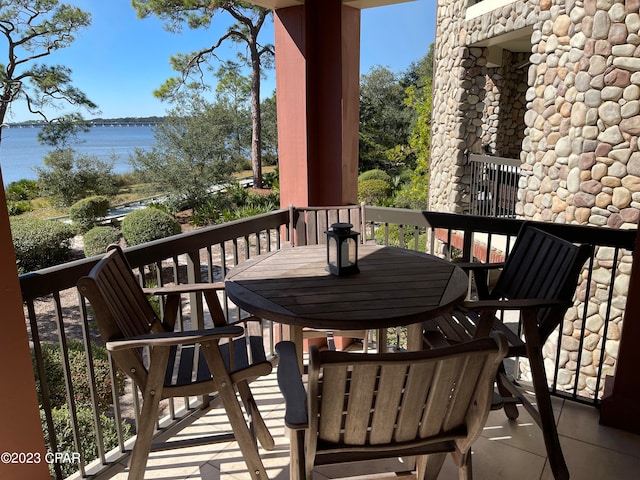 balcony featuring a water view