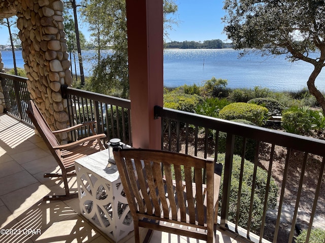 balcony featuring a water view