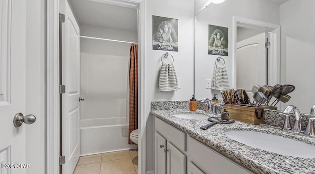 full bathroom with vanity, shower / tub combo with curtain, toilet, and tile patterned floors