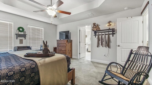 carpeted bedroom featuring ceiling fan and ensuite bathroom