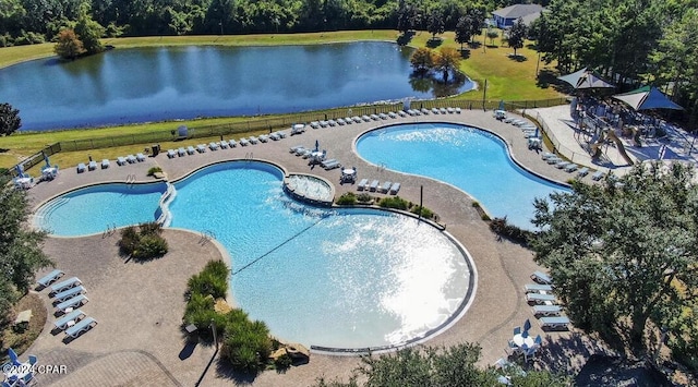 view of swimming pool featuring a patio, a water view, and a jacuzzi