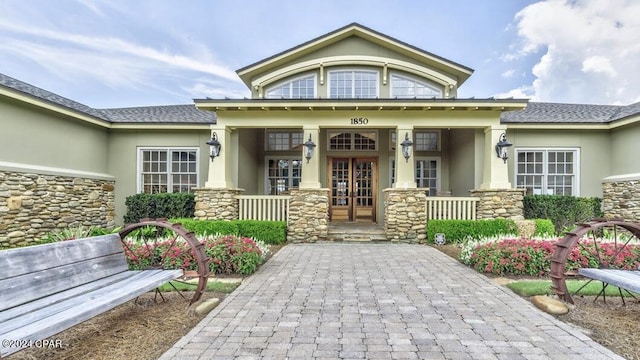 entrance to property featuring a porch