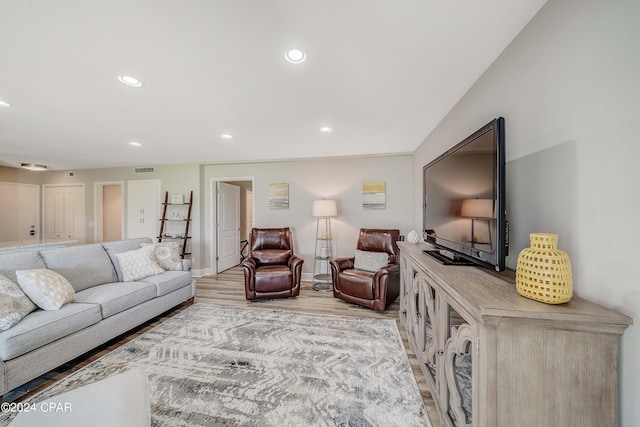 living room with light hardwood / wood-style flooring