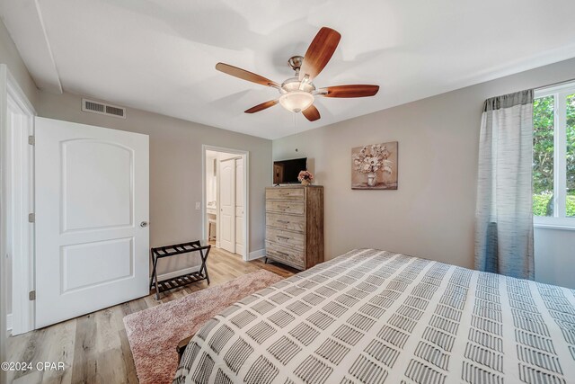 bedroom with ceiling fan and light hardwood / wood-style floors