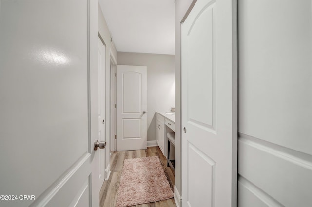 bathroom with hardwood / wood-style floors