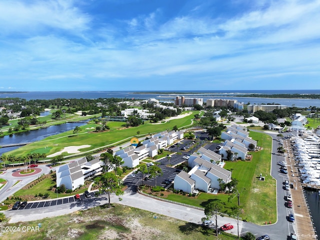 birds eye view of property with a water view