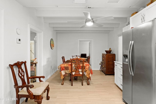 dining area with light wood-type flooring, ceiling fan, and beam ceiling