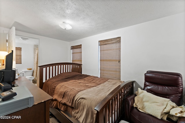 bedroom featuring a textured ceiling