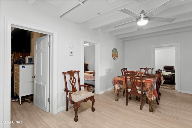 dining space with beamed ceiling and ceiling fan