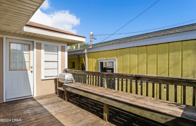 wooden terrace featuring grilling area