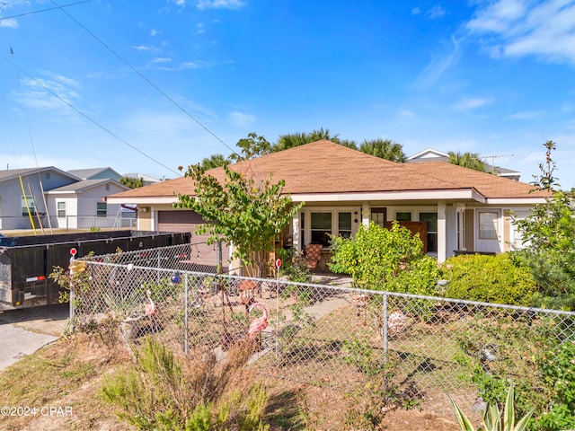 ranch-style home featuring a garage