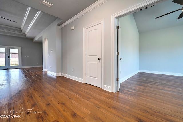 spare room featuring french doors, dark hardwood / wood-style floors, crown molding, and ceiling fan