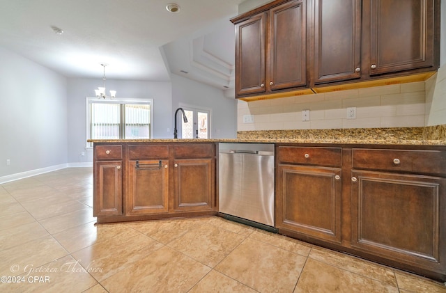 kitchen with backsplash, stainless steel dishwasher, stone countertops, and a notable chandelier