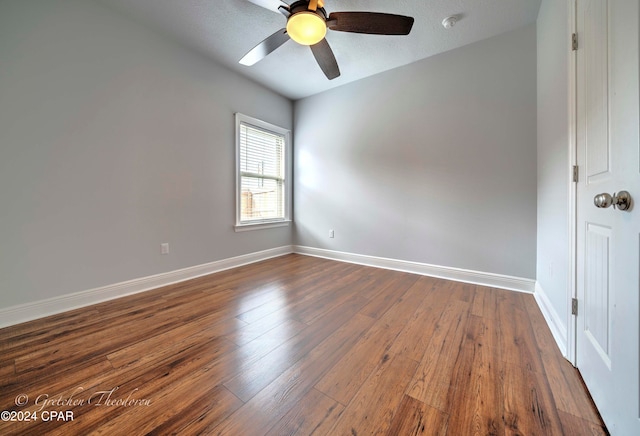 spare room with a textured ceiling, hardwood / wood-style floors, and ceiling fan