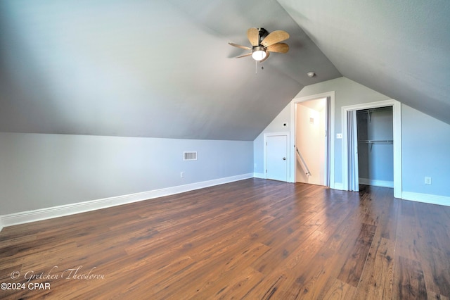 additional living space with vaulted ceiling, ceiling fan, and dark wood-type flooring