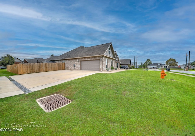 view of home's exterior with a yard and a garage