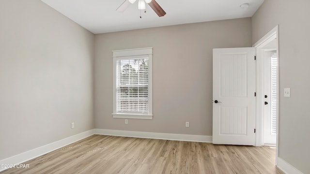 unfurnished room featuring ceiling fan and light wood-type flooring