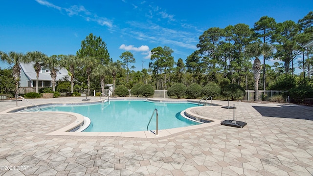 view of pool featuring a patio area