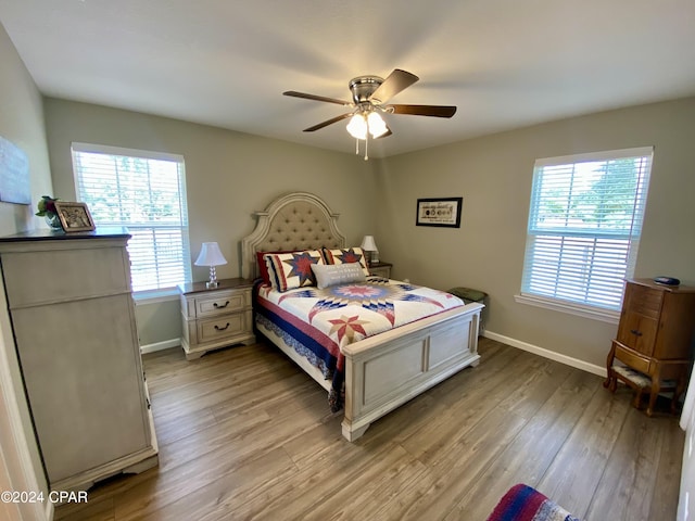 bedroom featuring ceiling fan and light hardwood / wood-style flooring