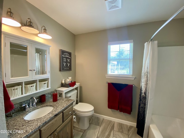 full bathroom featuring vanity, toilet, and shower / tub combo