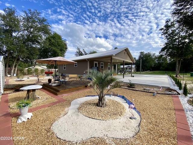 back of property with a wooden deck