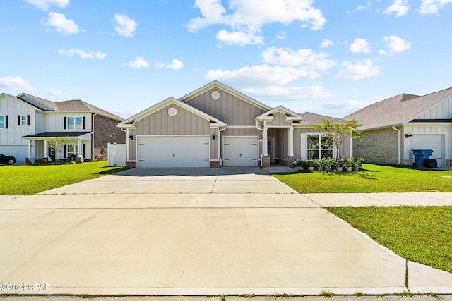 view of front of home with a front lawn and a garage