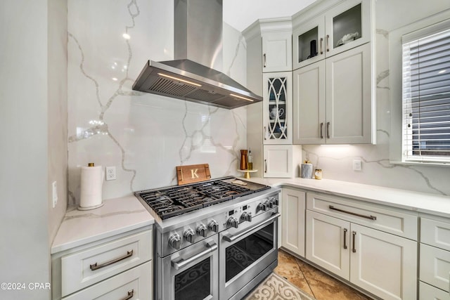 kitchen with double oven range, backsplash, a wealth of natural light, and extractor fan