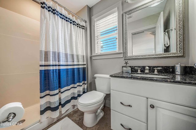 bathroom featuring vanity, toilet, walk in shower, and tile patterned flooring