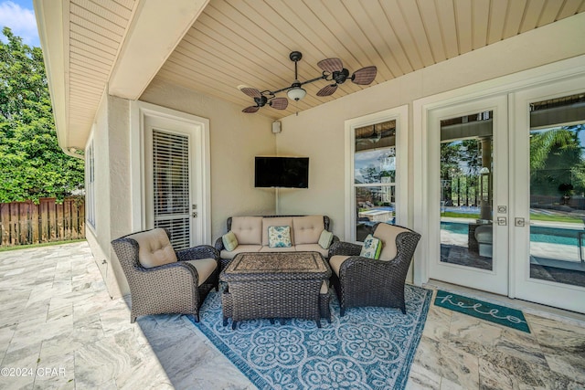 view of patio featuring ceiling fan, an outdoor hangout area, and french doors