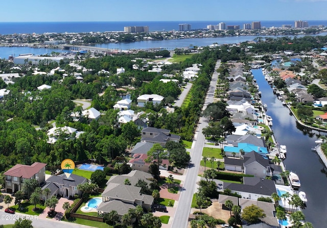 birds eye view of property with a water view