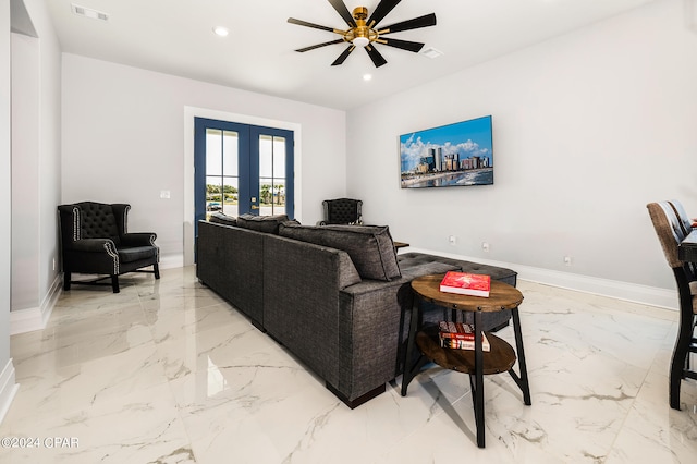 living room with ceiling fan and french doors