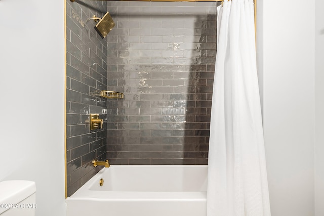 bathroom with shower / tub combo and toilet