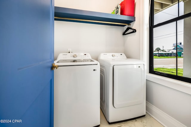 washroom featuring washer and clothes dryer