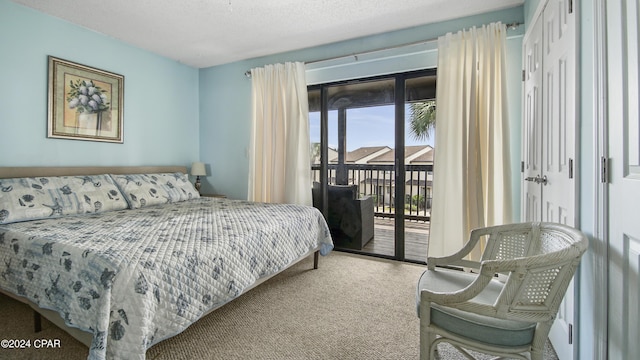 carpeted bedroom with access to exterior