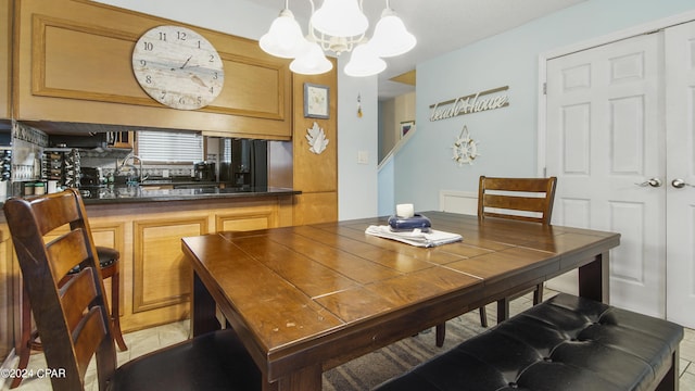 dining area featuring a notable chandelier