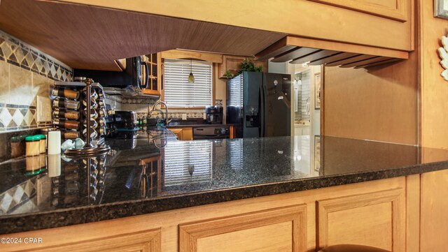 kitchen with black appliances and sink