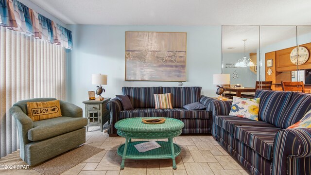 living room with a notable chandelier