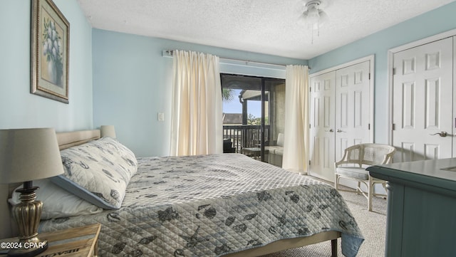 carpeted bedroom with access to outside, a textured ceiling, and ceiling fan