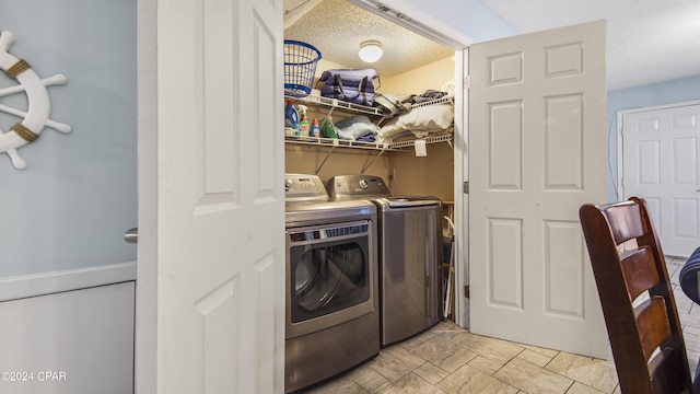 washroom featuring washing machine and dryer and laundry area