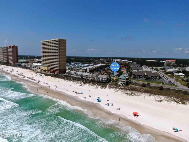 bird's eye view featuring a view of the beach and a water view